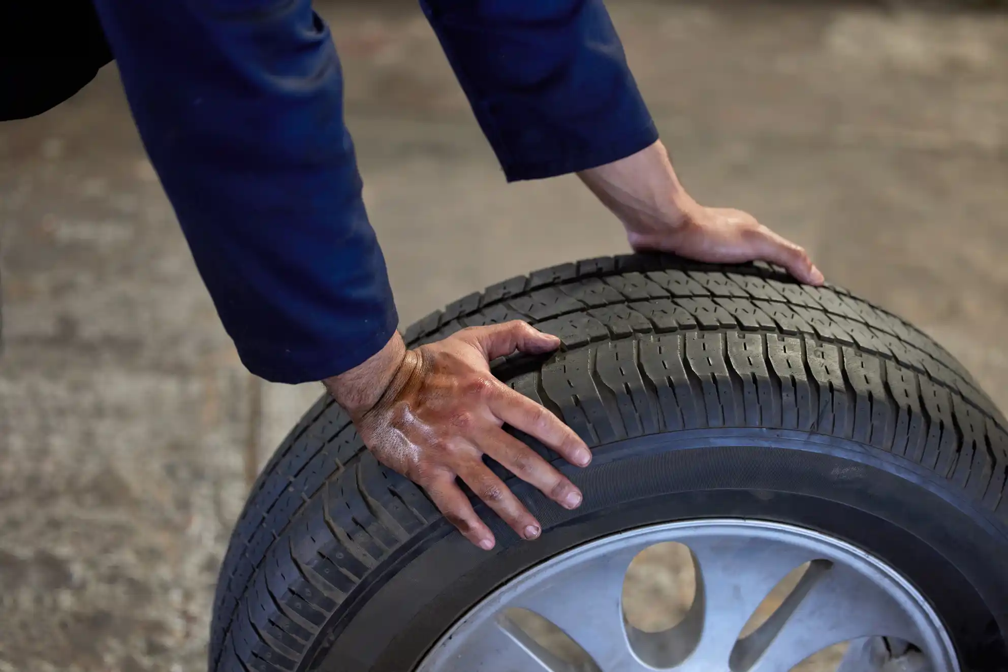 Checking tyre tread depth during a mobile tyre fitting in Southall